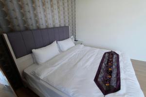 Postel nebo postele na pokoji v ubytování Jin Du Yi Yuan B & B