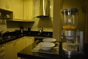 Cucina o angolo cottura di Kangaroo Wasi Airport Bed & Breakfast