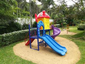 a playground with a slide in a park at Grindlays Regency in Ambepussa