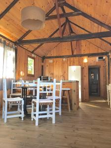 a dining room with a table and chairs in a barn at Sol de Bolonia 5 in Bolonia