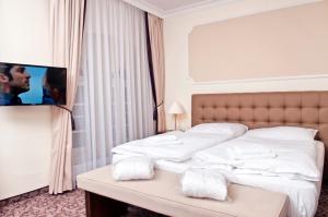 Postel nebo postele na pokoji v ubytování WINDSOR SPA Hotel