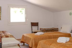 Ένα ή περισσότερα κρεβάτια σε δωμάτιο στο O Elatos