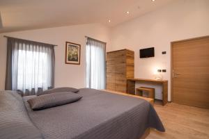 TV a/nebo společenská místnost v ubytování Hotel Ferrovia