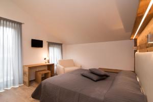 Postel nebo postele na pokoji v ubytování Hotel Ferrovia