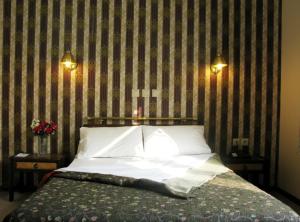 Posteľ alebo postele v izbe v ubytovaní Olympos Hotel