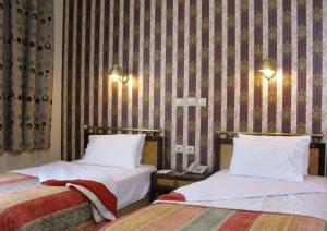 Posteľ alebo postele v izbe v ubytovaní Olympos Hotel