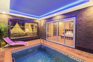 a house with a swimming pool with at منتجع مارينا جويل in Khamis Mushayt