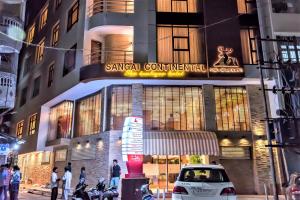 a car is parked in front of a building at Sangai Continental (The Boutique Hotel) in Imphal