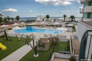 a view of a swimming pool in a resort at Residence Acquasuite in Martinsicuro