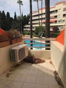 an air conditioner sitting on a floor next to a building at Parque Marbella in Marbella