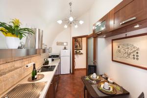 a kitchen with a sink and a counter top at Palazzo Castelleschi in Tarquinia