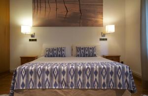 Säng eller sängar i ett rum på Villa Els Pins