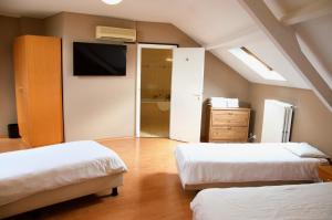 מיטה או מיטות בחדר ב-Hotel Frederiksborg