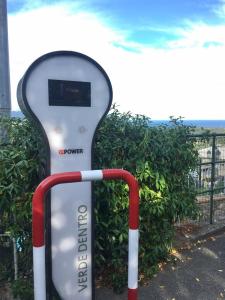 a remote control sitting in front of a fence at Le Ville Relais in La Spezia