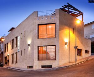 a large brick building with lights on a street at Llave de Granada in Alcalá la Real