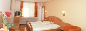 Un pat sau paturi într-o cameră la Rinchnacher Hof