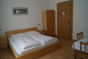Ένα ή περισσότερα κρεβάτια σε δωμάτιο στο Hotel "Wilder Mann"