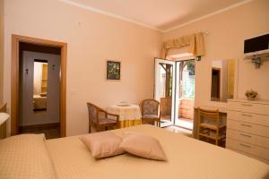 Postel nebo postele na pokoji v ubytování Albergo Ristorante il Fungo