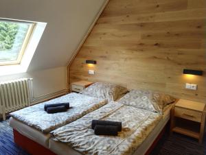 Postel nebo postele na pokoji v ubytování Hotel Žalý Apartmány