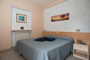 Postel nebo postele na pokoji v ubytování Albergo Ristorante il Fungo