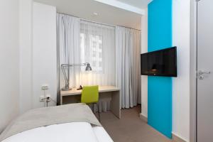 TV a/nebo společenská místnost v ubytování MediInn Hotel Oslo