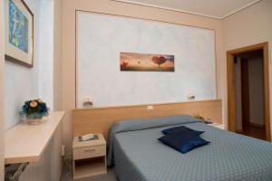 Postel nebo postele na pokoji v ubytování Albergo Ristorante il Fungo