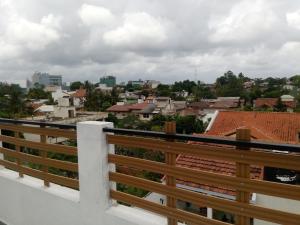 a view of a city from a balcony at Queens Park Apartments in Colombo