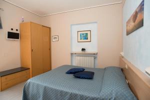 Postel nebo postele na pokoji v ubytování Albergo Ristorante il Fungo