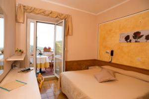 Postel nebo postele na pokoji v ubytování Albergo Ristorante il Fungo