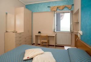 Postel nebo postele na pokoji v ubytování Albergo Ristorante il Fungo