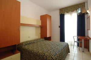 Posteľ alebo postele v izbe v ubytovaní Hotel Lido
