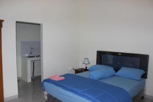 Postel nebo postele na pokoji v ubytování Ady Homestay