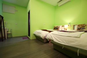 Postel nebo postele na pokoji v ubytování Xincheng Old Street B&B