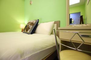Postel nebo postele na pokoji v ubytování Xincheng Old Street B&B