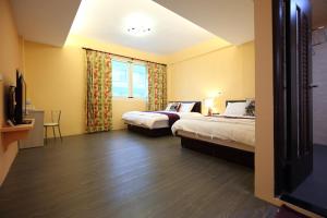 Postel nebo postele na pokoji v ubytování Xincheng Old Street B&B
