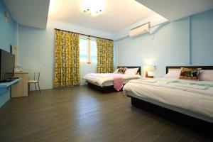 Postel nebo postele na pokoji v ubytování Xincheng Old Street B&B