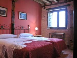 Posteľ alebo postele v izbe v ubytovaní Las Casas del Duraton