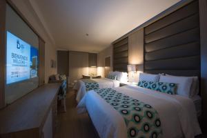 Ένα ή περισσότερα κρεβάτια σε δωμάτιο στο Hotel Dann Carlton Medellín