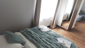 Postel nebo postele na pokoji v ubytování Vigan Apartamenty