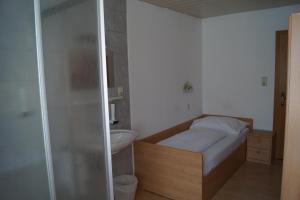 Ένα ή περισσότερα κρεβάτια σε δωμάτιο στο Hotel "Wilder Mann"