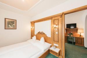 Łóżko lub łóżka w pokoju w obiekcie Hotel Hoferwirt