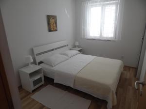 Кровать или кровати в номере Apartment Saric