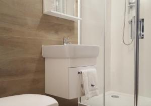 Koupelna v ubytování Vigan Apartamenty + 22 fotografií
