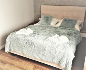 Postel nebo postele na pokoji v ubytování Vigan Apartamenty