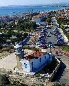 an aerial view of a parking lot with a lighthouse at Villa Galleria in Perivolia