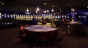 a casino with a table and chairs in a room at Apart Great Sea View in Alvor