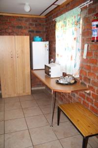 Kuchyň nebo kuchyňský kout v ubytování Pondoki Rest Camp
