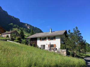a house on the side of a hill at Schwendi Maison in Mels