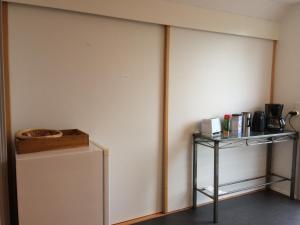 a room with two sliding doors and a shelf at Mikkelborg B&B in Hørsholm