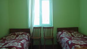 Postel nebo postele na pokoji v ubytování Mila Guest House